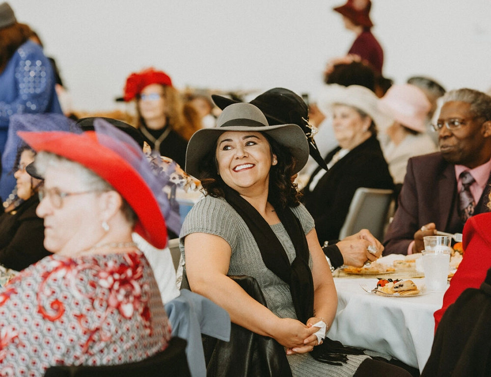 People at a luncheon listening to a speaker.