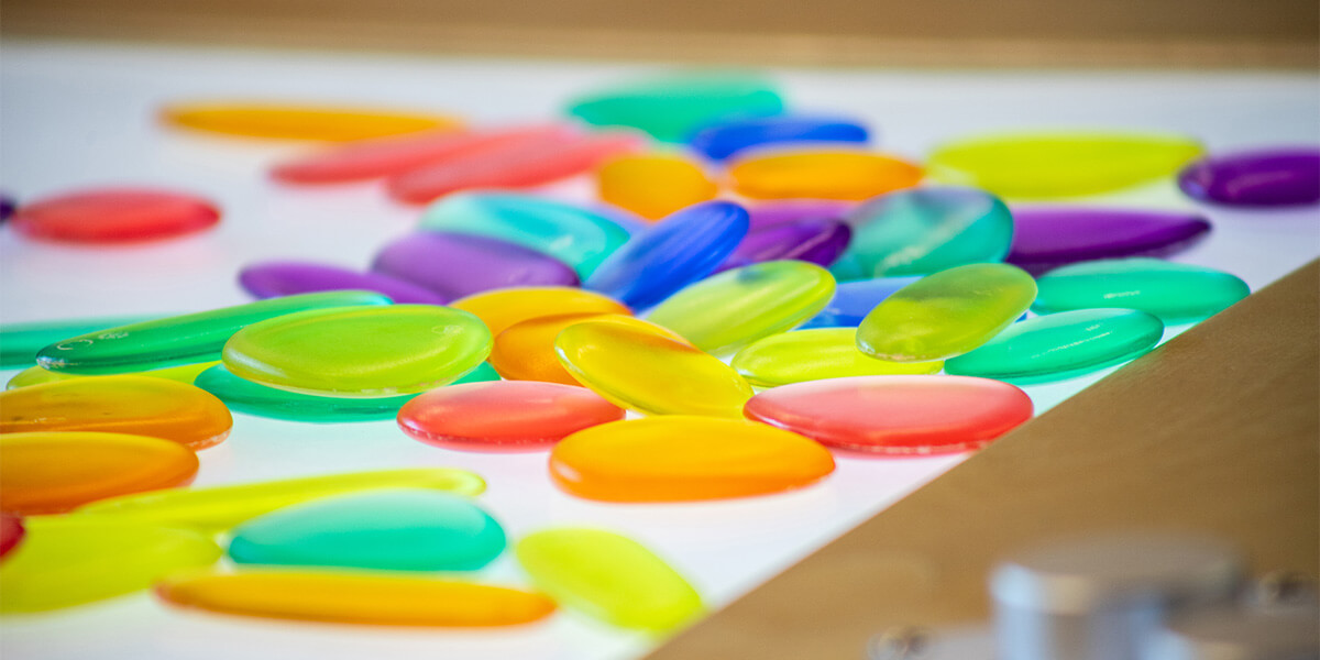 Colorful chips laying on a table.