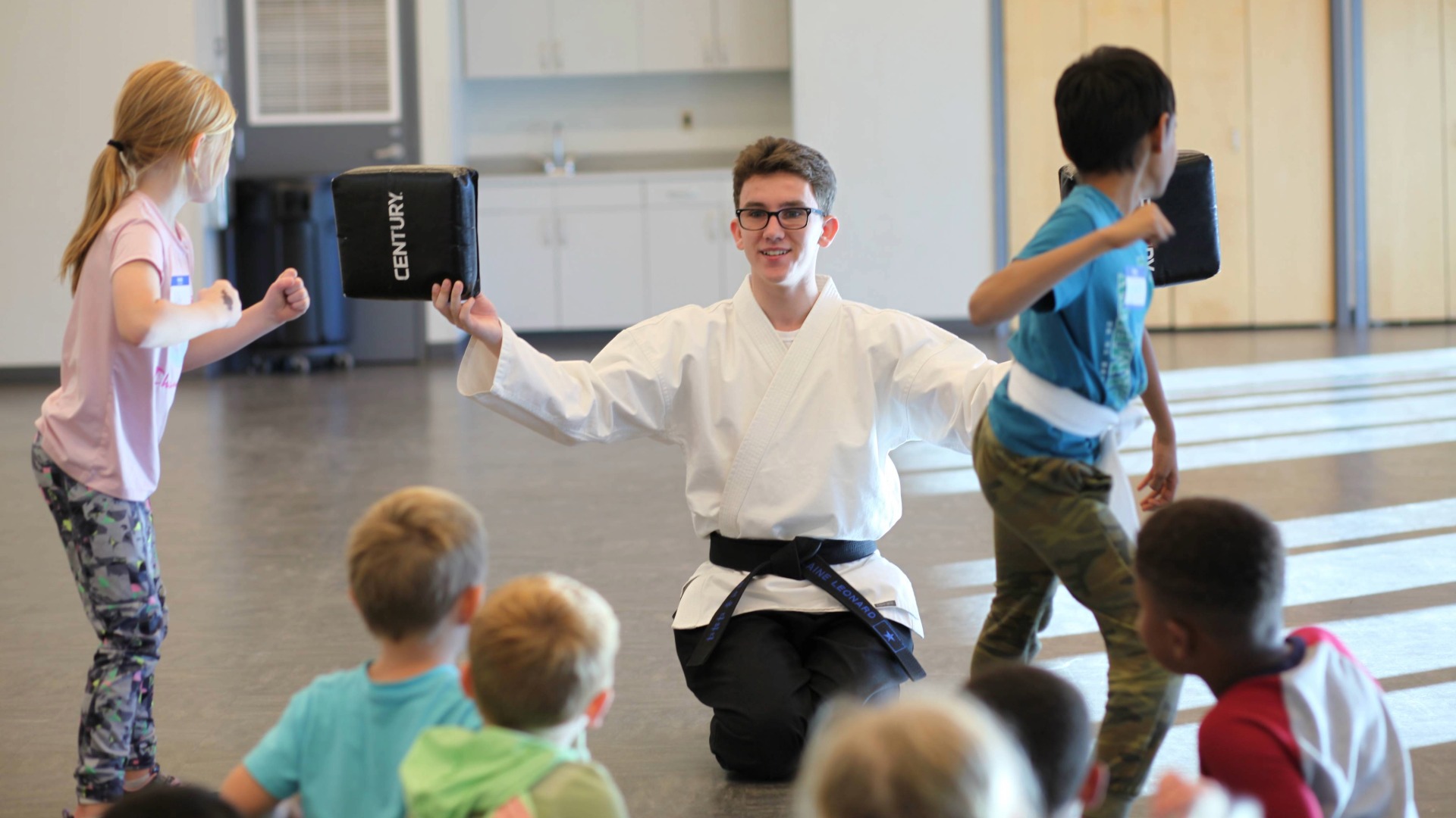 boys and girls practice in a Taekwondo class at the library