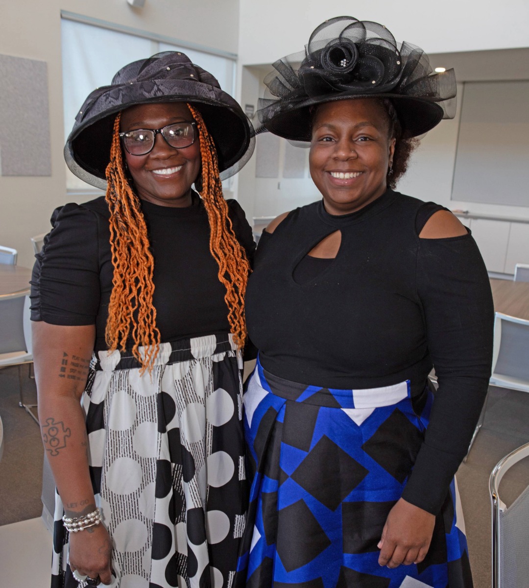 two ladies wearing church hats at the Crowns Tea