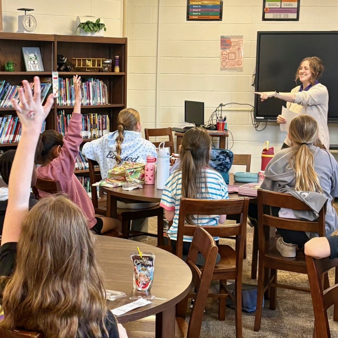 elementary students participate in a book club discussion