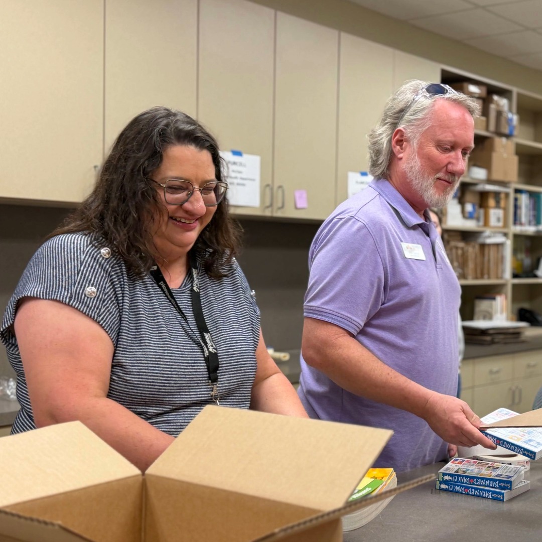library staff and volunteers preparing books for delivery